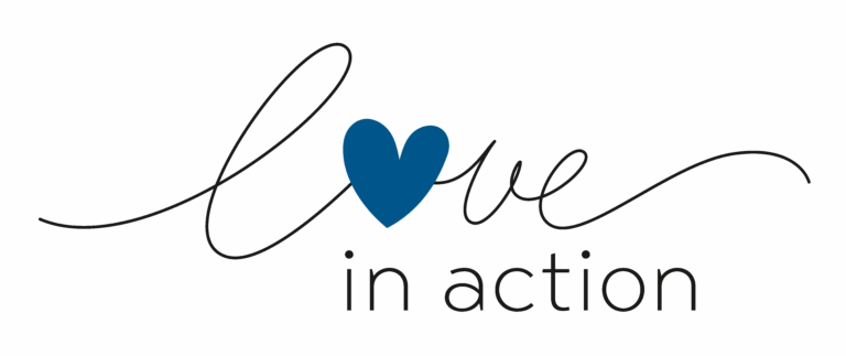 Blue heart with 'love in action' text on dark background.